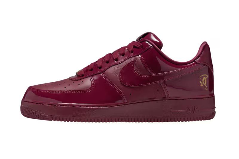 Syna x Nike Air Force 1 '07 Dark Beetroot and Red Oxide colorway with metallic gold accents, lateral view