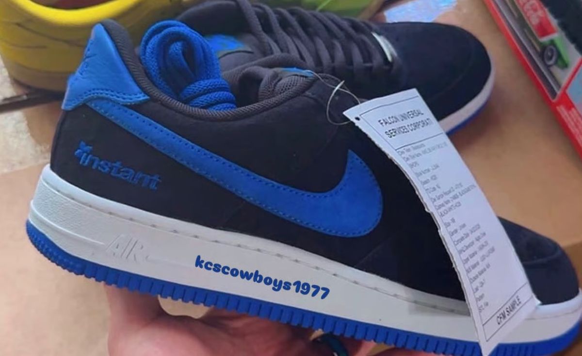 Instant x Nike SB Air Force 1 in black suede with blue accents, side profile view