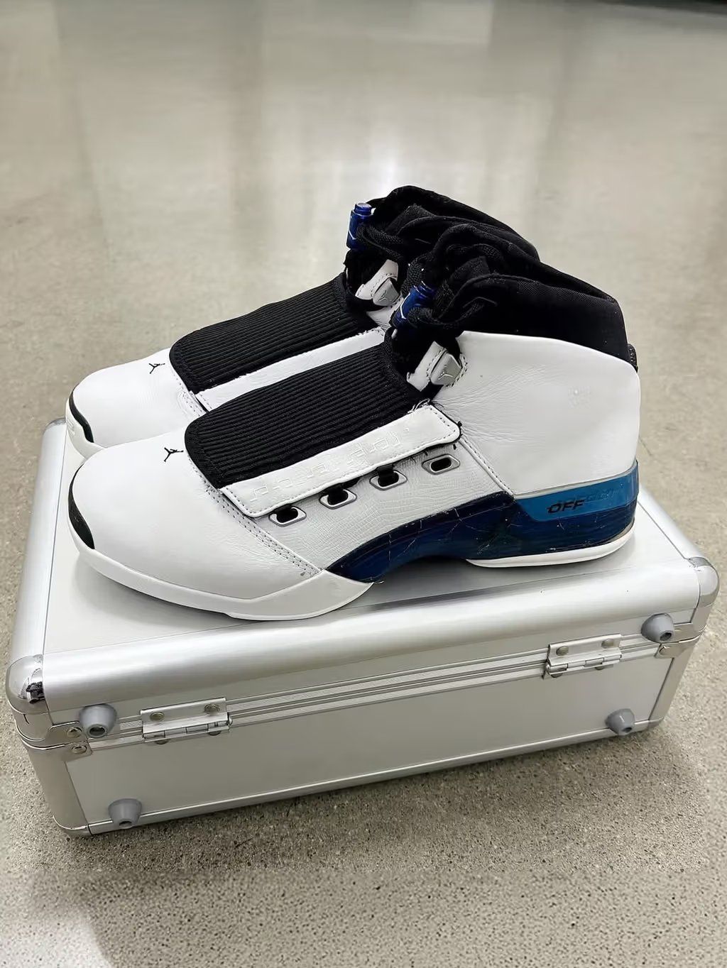 Air Jordan 17 College Blue colorway, full lateral view showing the classic 1999 silhouette in blue with neutral accents
