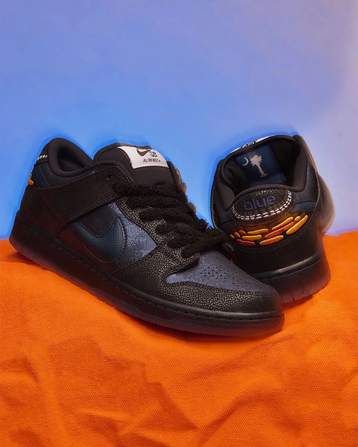 Bluetile x Nike SB Dunk Low Monarch Butterfly in orange and black with fuzzy lacing and hexagonal Swoosh detail