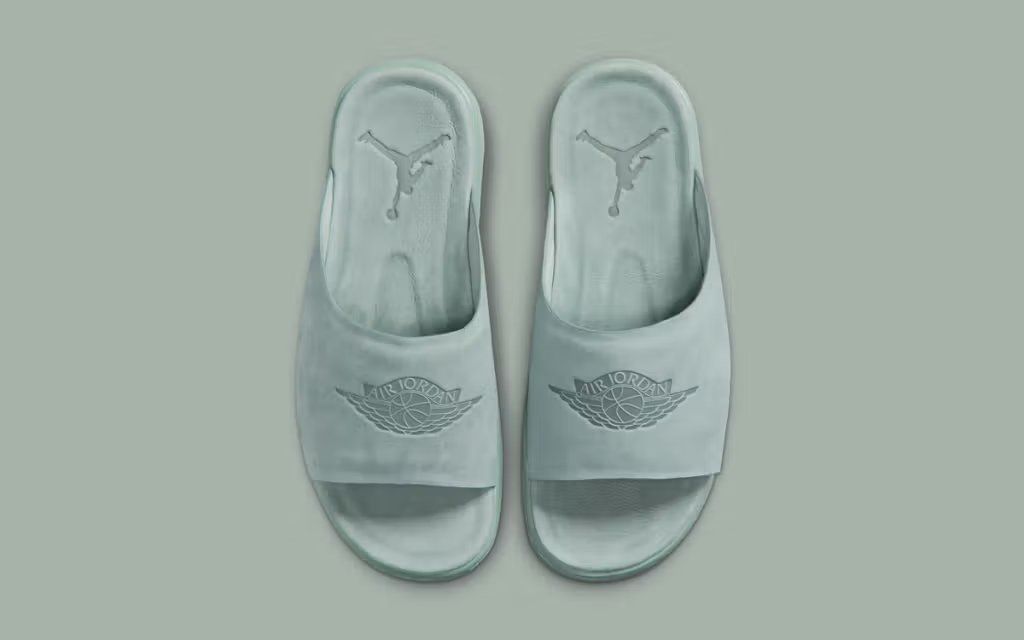 Women's Jordan Modero 1 Slide in neutral colorway, showcasing contoured footbed and soft upper construction