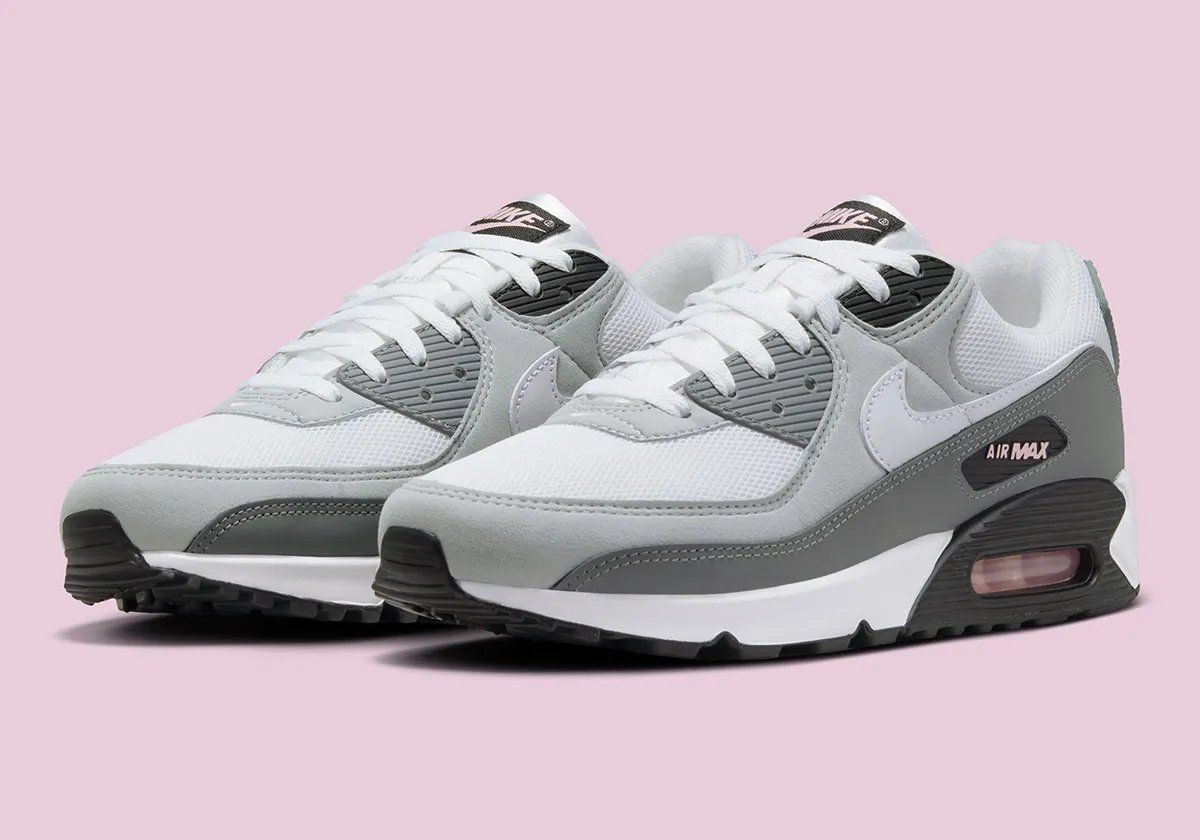 Nike Air Max 90 in Pink Foam colorway with visible Air unit and curved Swoosh geometry