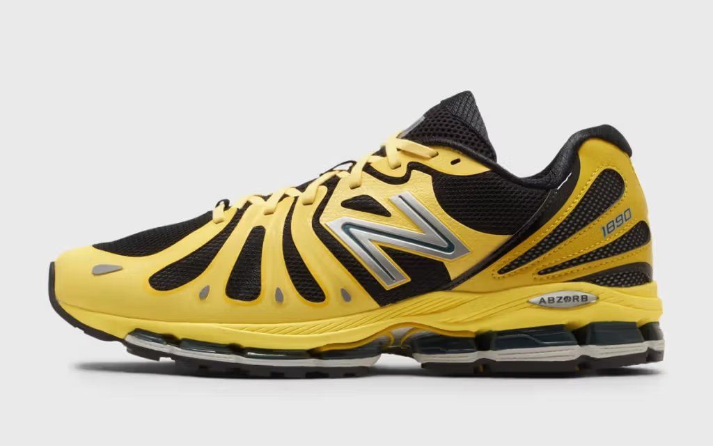 New Balance 1890 in black and yellow colorway, featuring contrast side paneling and vintage-inspired silhouette