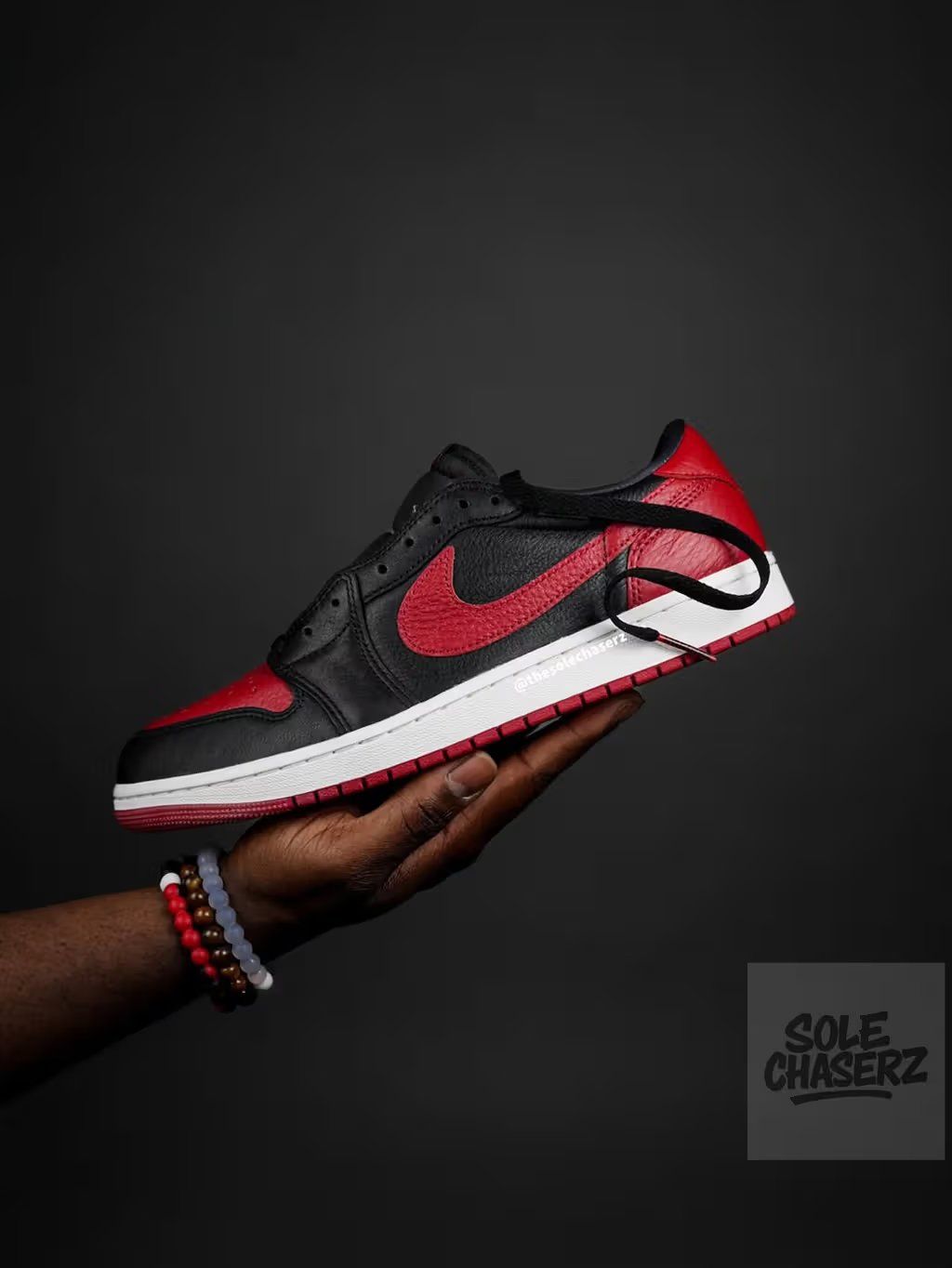 Air Jordan 1 Low OG in classic Banned red, black, and white colorway