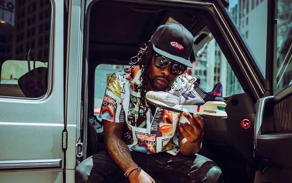 Wale wearing New Balance sneakers, positioned during sneaker free agency discussions with the Boston-based brand