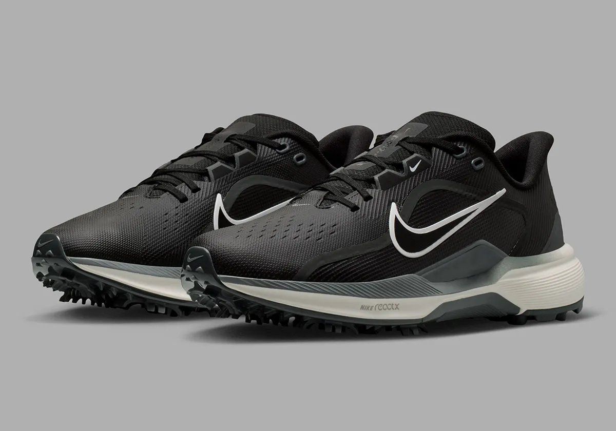 Nike Pegasus 1 Golf in black colorway, showing lateral support plates and hybrid traction system