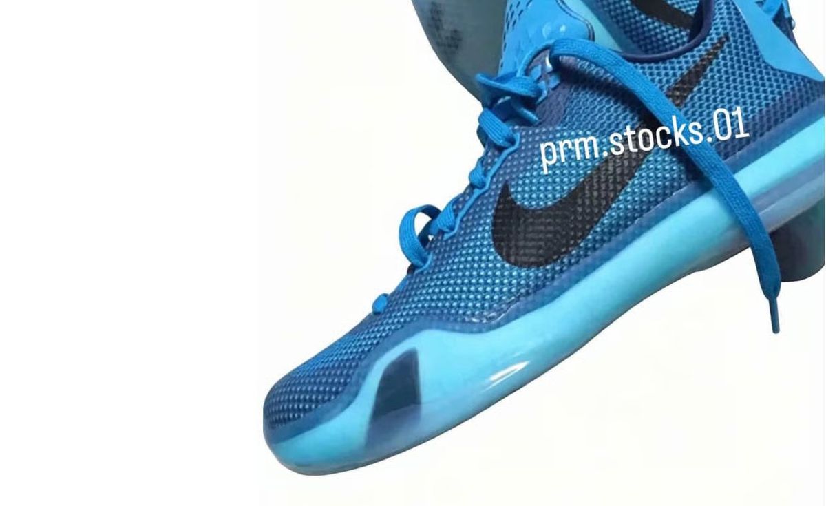 Nike Kobe 10 EM Protro 5 AM Flight featuring Blue Lagoon engineered mesh upper with black Swoosh and red heel stitching detail