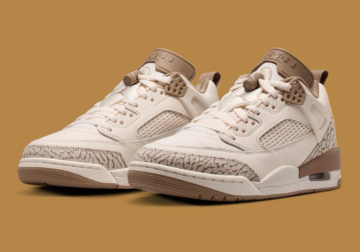 Jordan Spiz'ike Low in contemporary color palette, showing complex multi-panel design with layered mesh and overlays