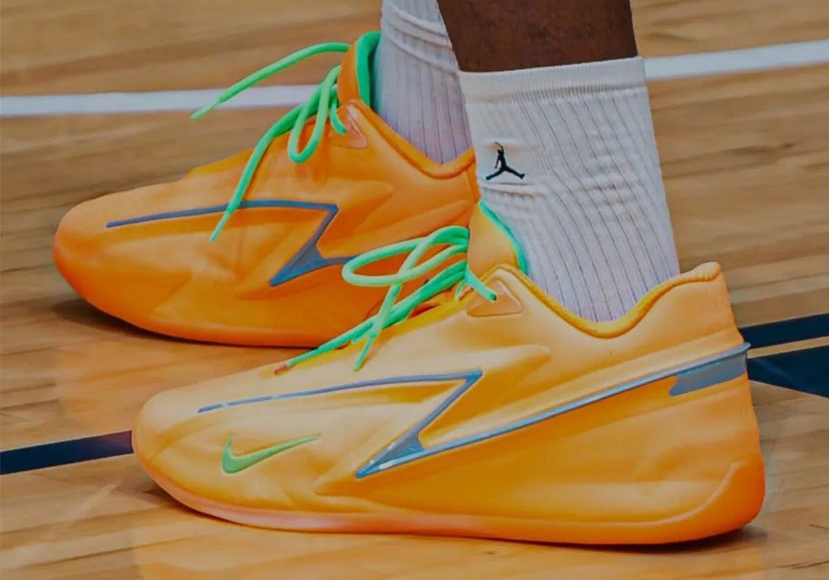Nike KD 19 EYBL Peach Jam colorway featuring pale orange base with steely blue Z-shaped overlays and neon green accents