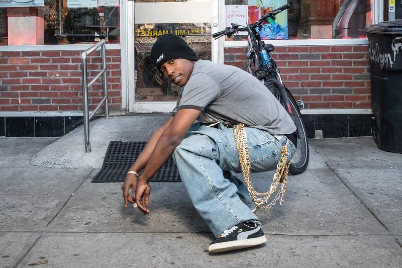 A$AP Rocky x PUMA Suede '94 in black with gold lace keeper and retro quarter-panel logo, July 2026 release