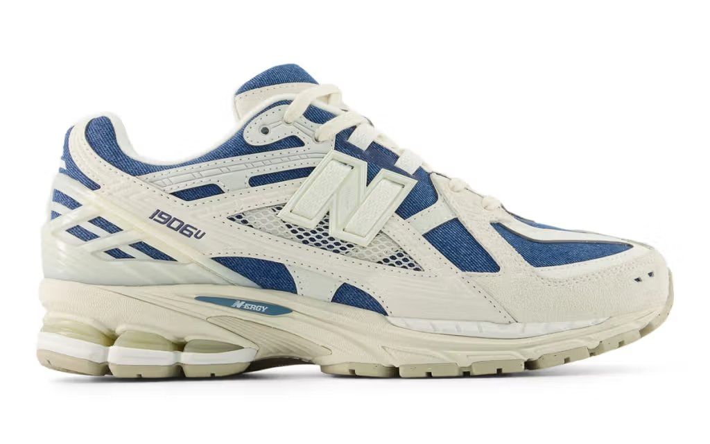 New Balance 1906U in denim colorway, featuring blue chambray and indigo upper with neutral midsole