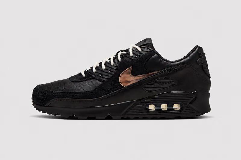 Wagyu x Nike Air Max 90 in Black and Anthracite with custom cow-head heel badge, featuring shaggy suede and perforated leather upper construction