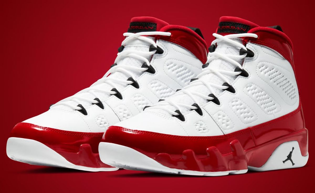 Air Jordan 9 Retro in White and Gym Red colorway, showing the mesh overlay and signature ankle collar design