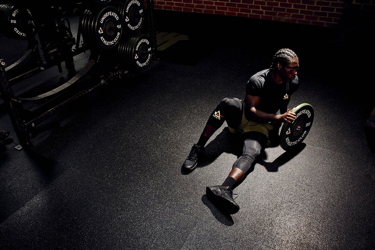 UNDEFEATED x Nike Athletic Club performance apparel collection featuring technical training pieces in minimal colorways