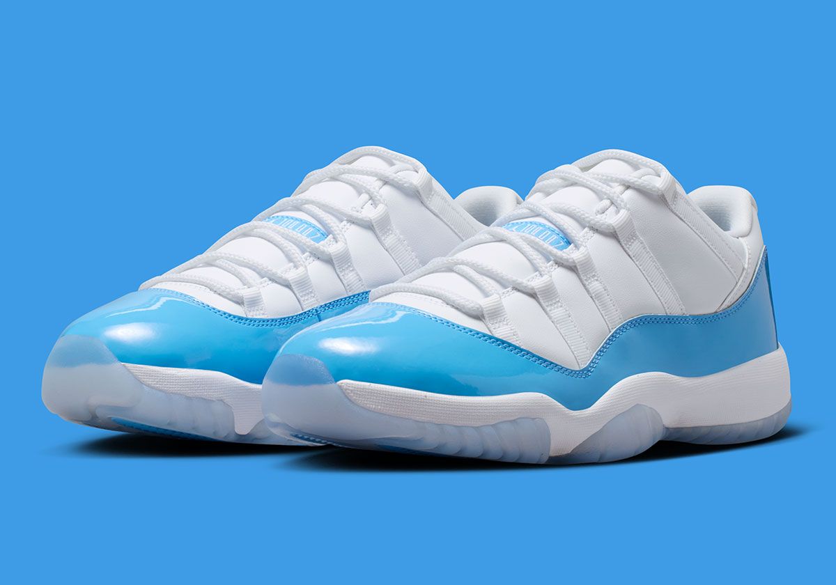 Air Jordan 11 Low in University Blue and white, showing mudguard detail and icy translucent sole