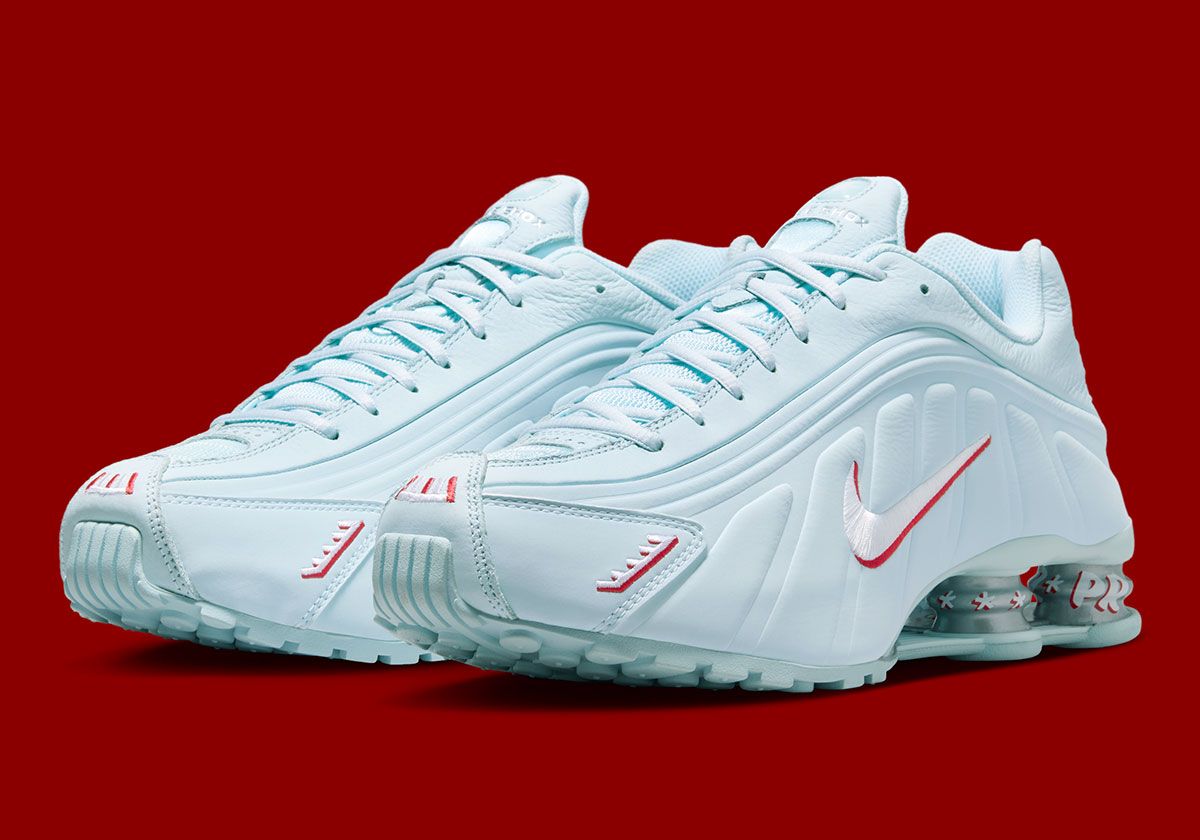Nike Shox R4 Puerto Rico edition in light blue with red and white accents, featuring removable vejigante charm