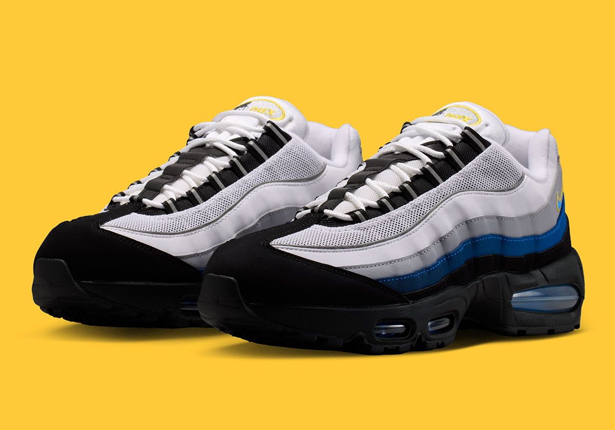 Nike Air Max 95 in Royal Blue with black and yellow accents, featuring visible air bubble units and segmented overlays