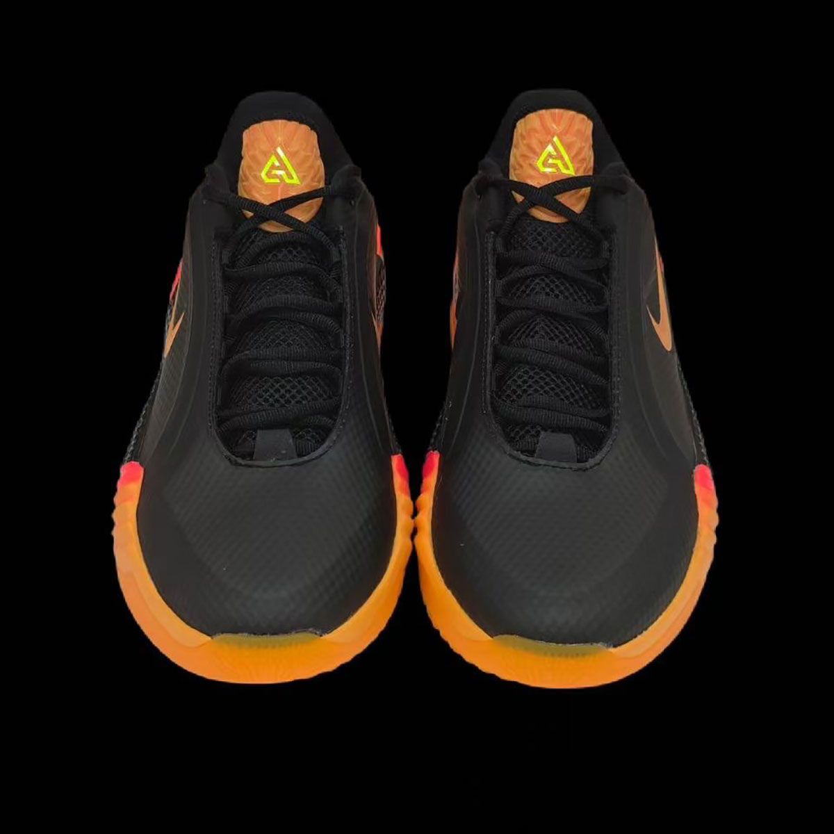 Nike Giannis Freak 8 in lava black, orange, and red colorway showing curved molded sole and textured mesh upper