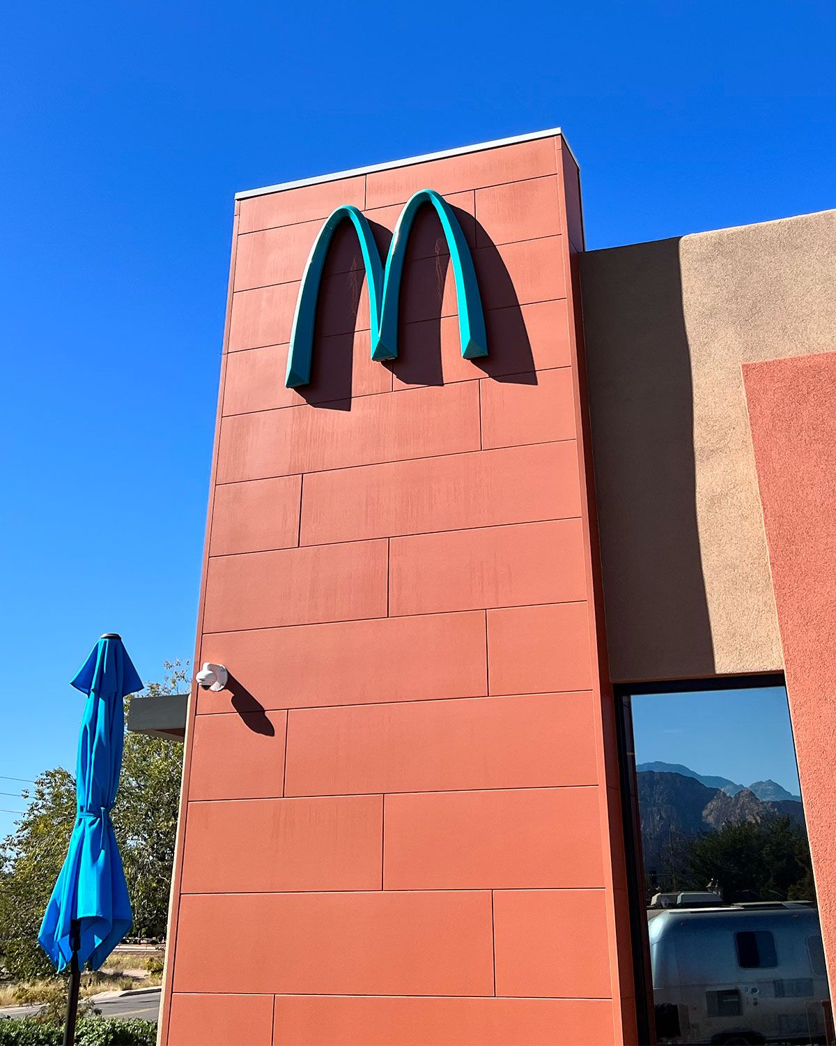 Nike Book 2 Sedona collaboration in light tan and brown with turquoise McDonald's branding, inspired by Arizona desert tones.