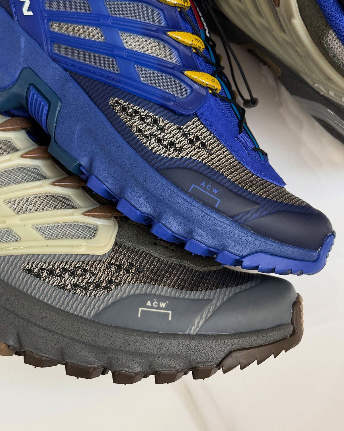 A-COLD-WALL* x Salomon ACS Pro in olive green and beige with grey midsole, detail view of lace eyelet woodgrain finish