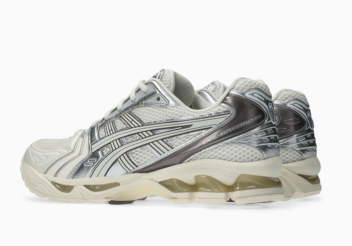 ASICS GEL-Kayano 14 in Cream and Cocoa Powder colorway, showcasing off-white mesh upper with metallic silver side panels and brushed cocoa heel detailing