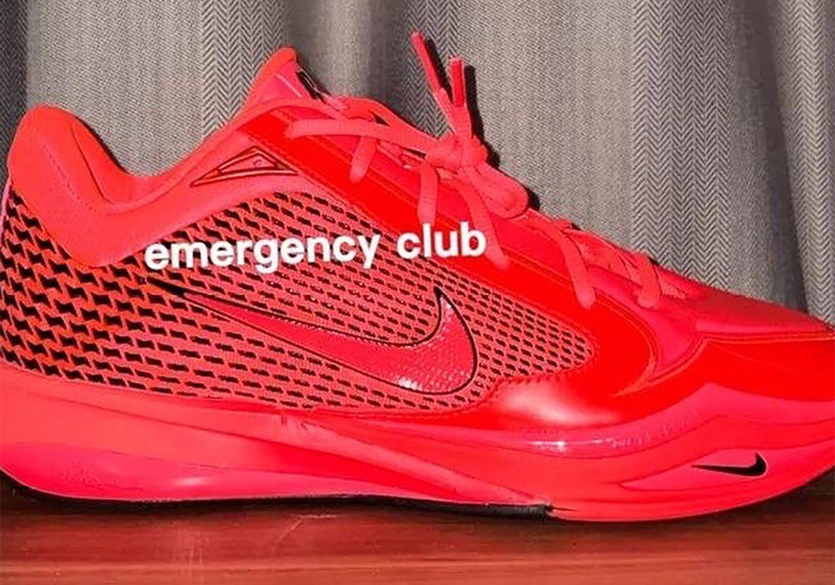 Nike Sabrina 4 in red and black colorway, showing geometric mesh construction and houndstooth texture on lateral panels