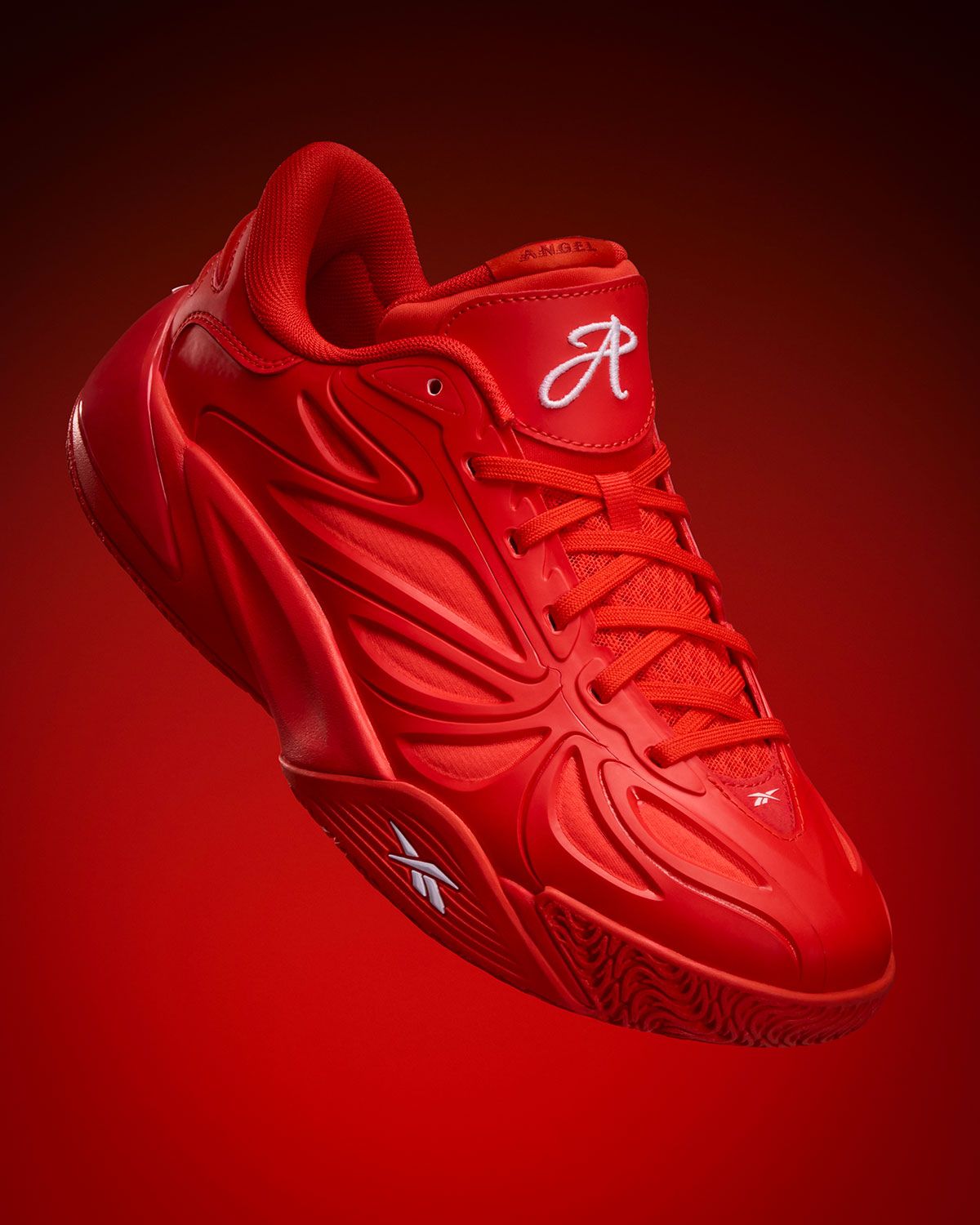 Reebok Angel Reese 1 in Atlanta Dream red with white branding, lateral view