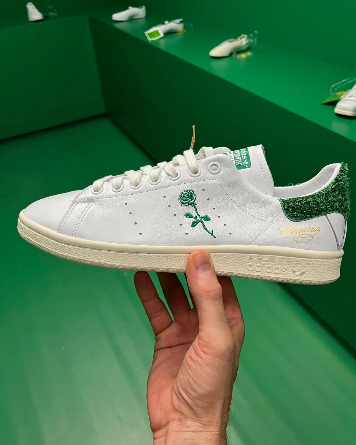 Willy Chavarria x adidas Stan Smith with embroidered rose detail and hairy suede heel tab, shown in white and green colorway at Paris Fashion Week