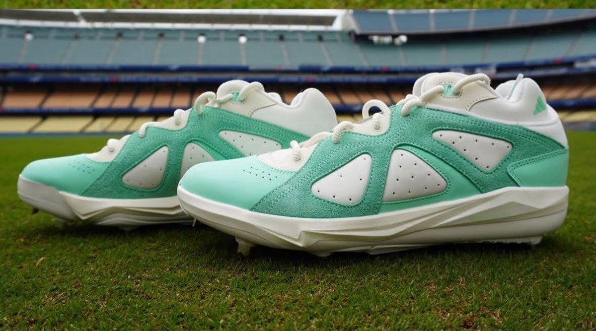Kiké Hernández wears exclusive mint green adidas BadBo 1.0 cleats on field at Fenway Park