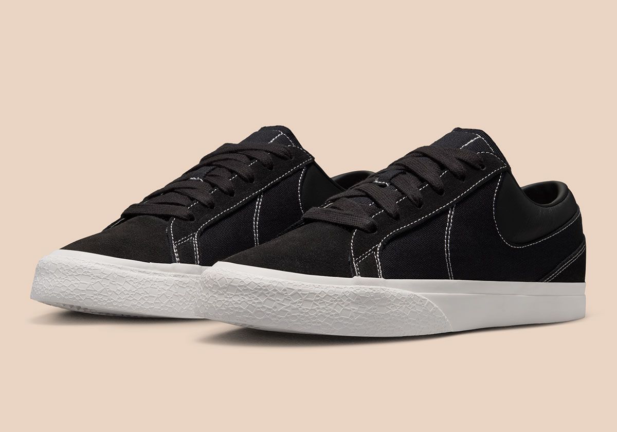 Nike Blazy in Sail colorway, showing exaggerated heel drag and curved Swoosh stitching detail on canvas panels