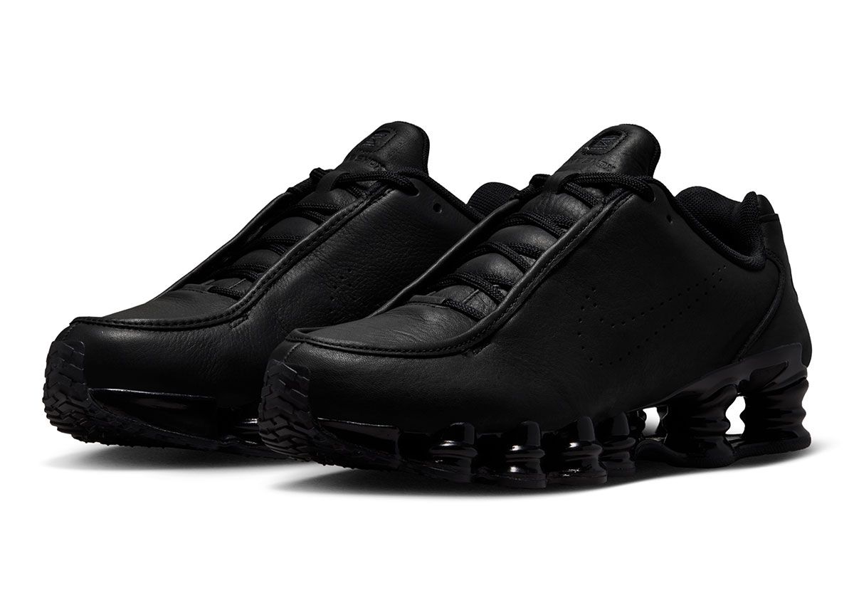 Nike Shox TL all-black leather edition with perforated Swoosh detail and full-length Shox tooling