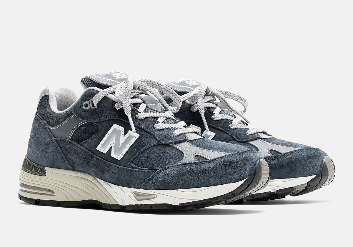 New Balance 991 Essential in black and navy colorways featuring premium nubuck uppers and white contrast sole units