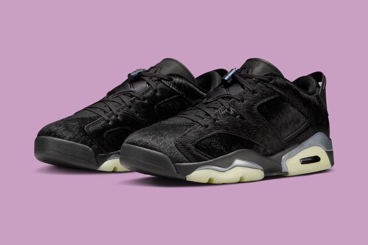 Air Jordan 6 Low WMNS Blackout in full black colorway, lateral view showing wings emblem and ankle strap detail