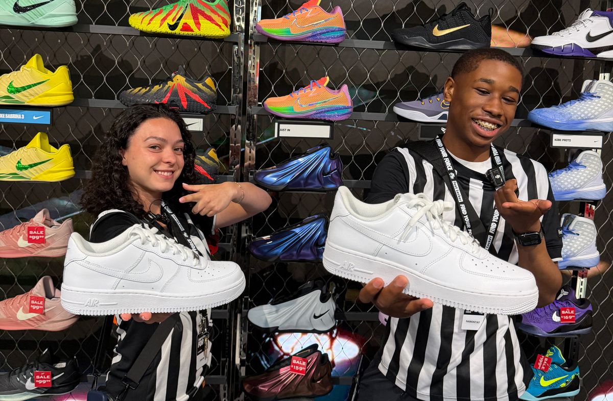 Nike Air Force 1 displayed in Foot Locker retail setting with employee engagement