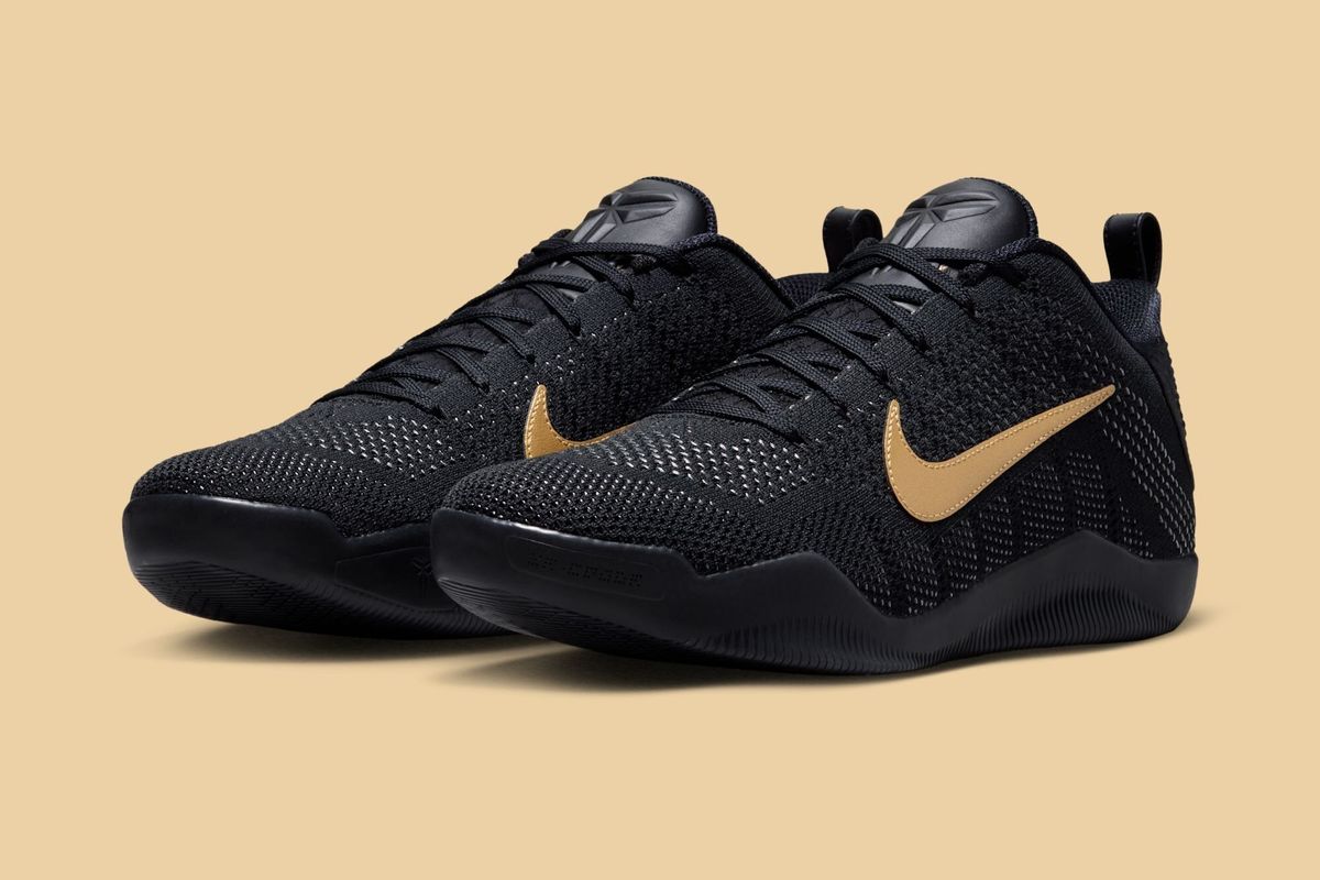Nike Kobe 11 Elite Low Protro in Fade to Black colorway, featuring gradient dark charcoal to black upper with low-cut silhouette design
