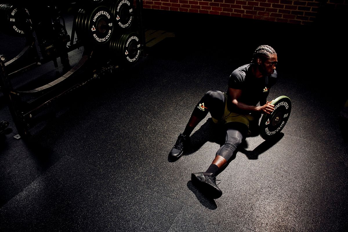 UNDEFEATED x Nike Athletic Club performance apparel collection featuring technical training pieces in minimal colorways