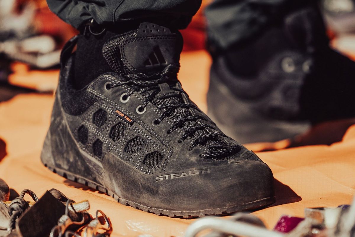 adidas Five Ten Guide Tennie in Core Black, side profile view showing tonal black construction and heritage outdoor design