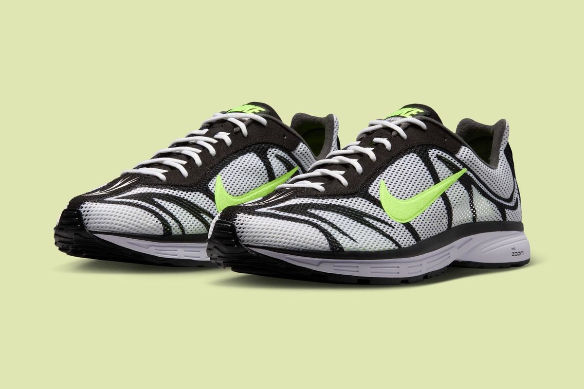 Nike Zoom Streak 3 in White and Volt colorway, side profile view showing the lightweight silhouette and yellow-green accents