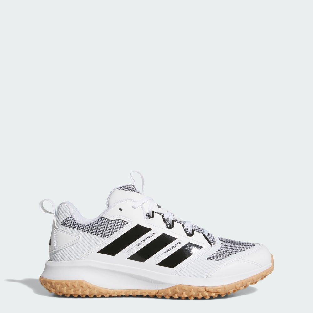 Adidas Adizero DGT Turf Trainer in lateral view, showing responsive midsole and turf-grip outsole design