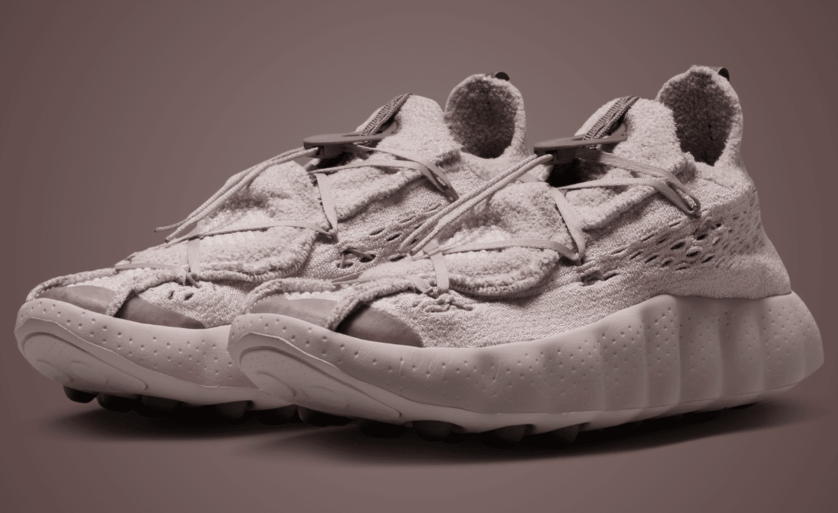 Nike Mind 002 Flyknit in Fossil Stone colorway, featuring neutral knit upper with tonal construction