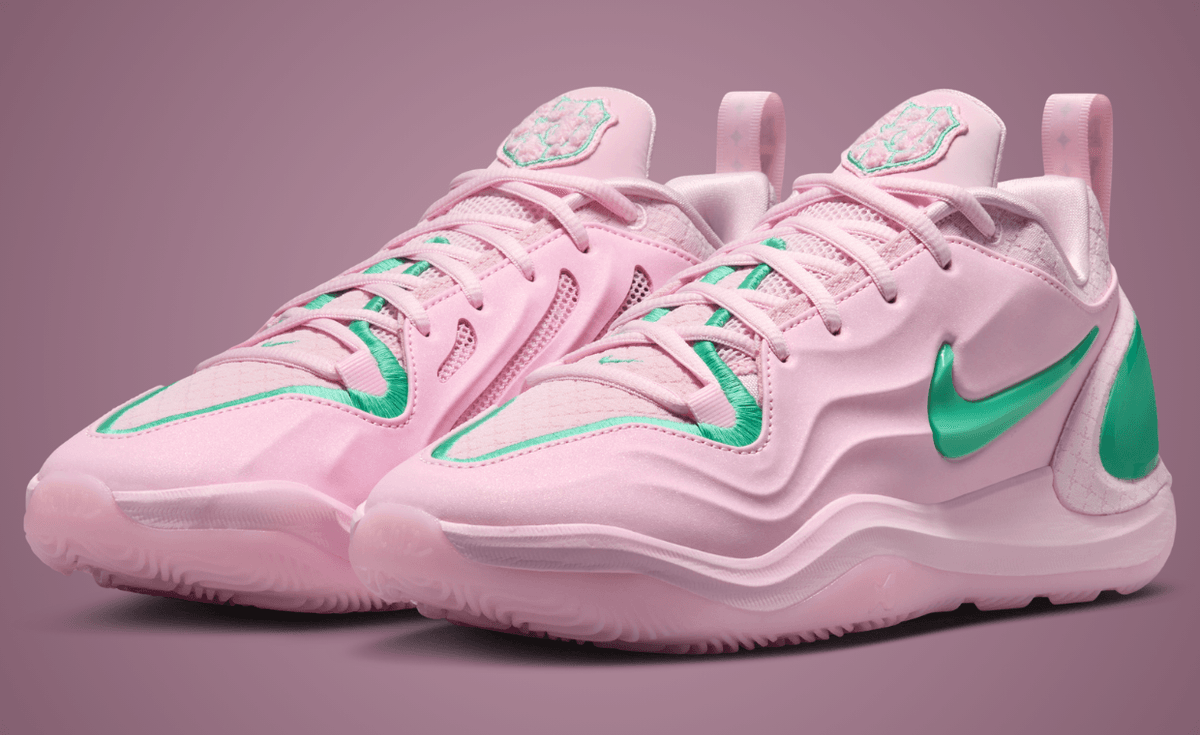 Nike A'Two Pinkies Up in pink and green Alpha Kappa Alpha colors, shown from side angle with embroidered toebox border and green Swoosh detail