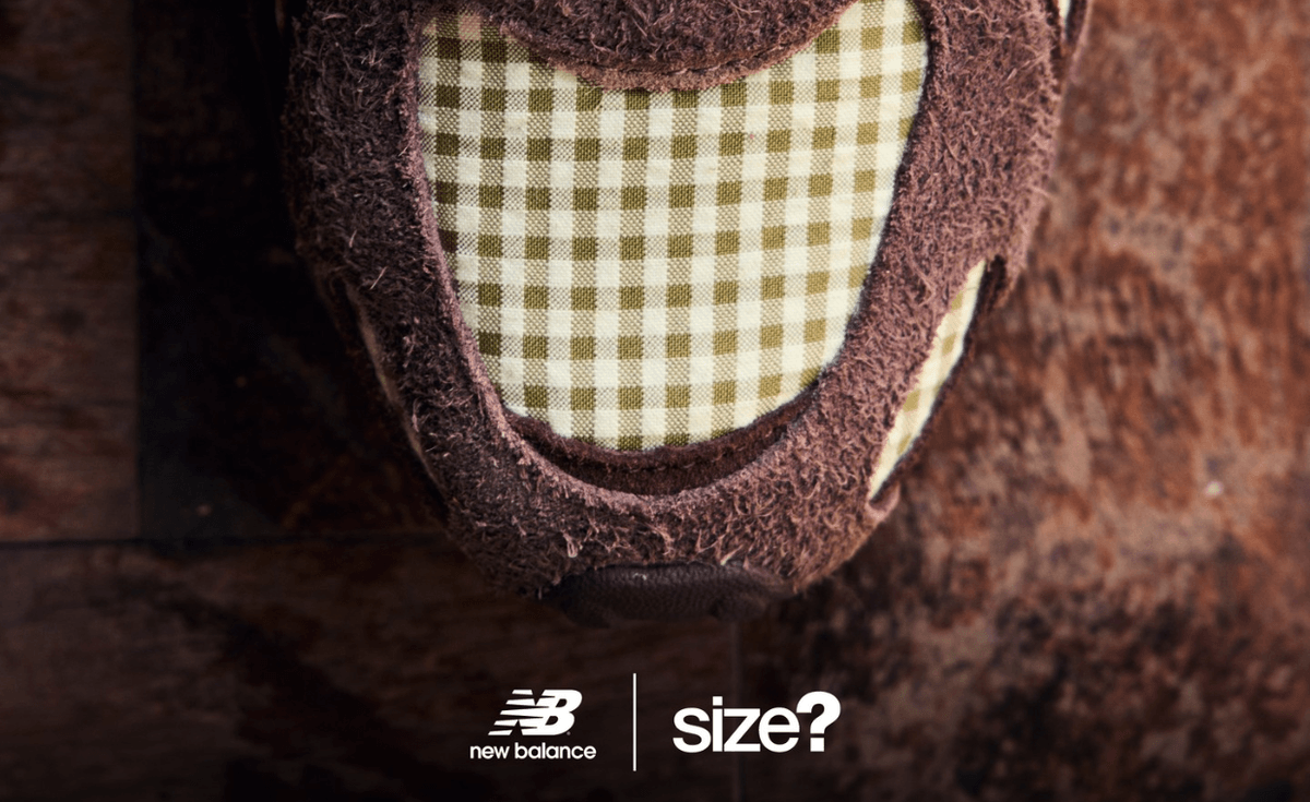 size? x New Balance 204L in brown suede with green picnic table checkerboard print on toebox, shown with dual brown and pink striped laces