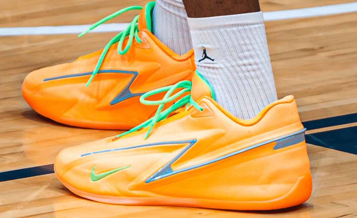 Nike KD 19 EYBL Peach Jam PE in bright orange with green peach stem accents and steel blue stabilization panels