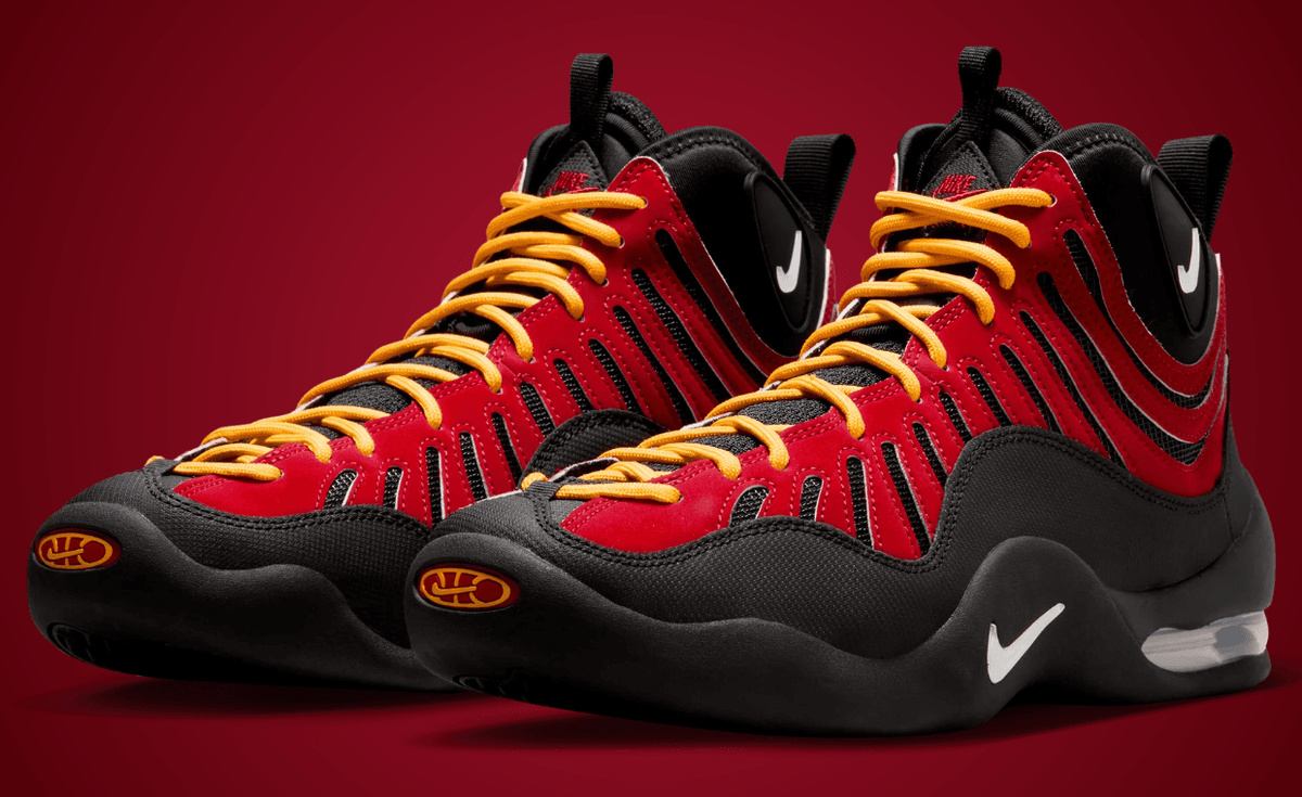 Nike Air Bakin OG in classic red, black, and yellow colorway showing the wavy red nubuck upper and black ballistic toecap