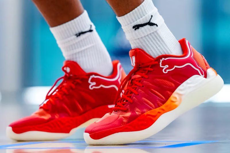 PUMA Hali 1 'Troy Bolton' Player Exclusive in red and orange, featuring East High Wildcats colorway and Troy's No. 14 on the tongue