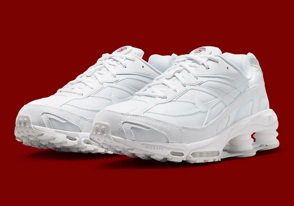 Nike Shox Ride 2 in Triple White colorway, showing full white upper, midsole, and visible Shox cushioning units
