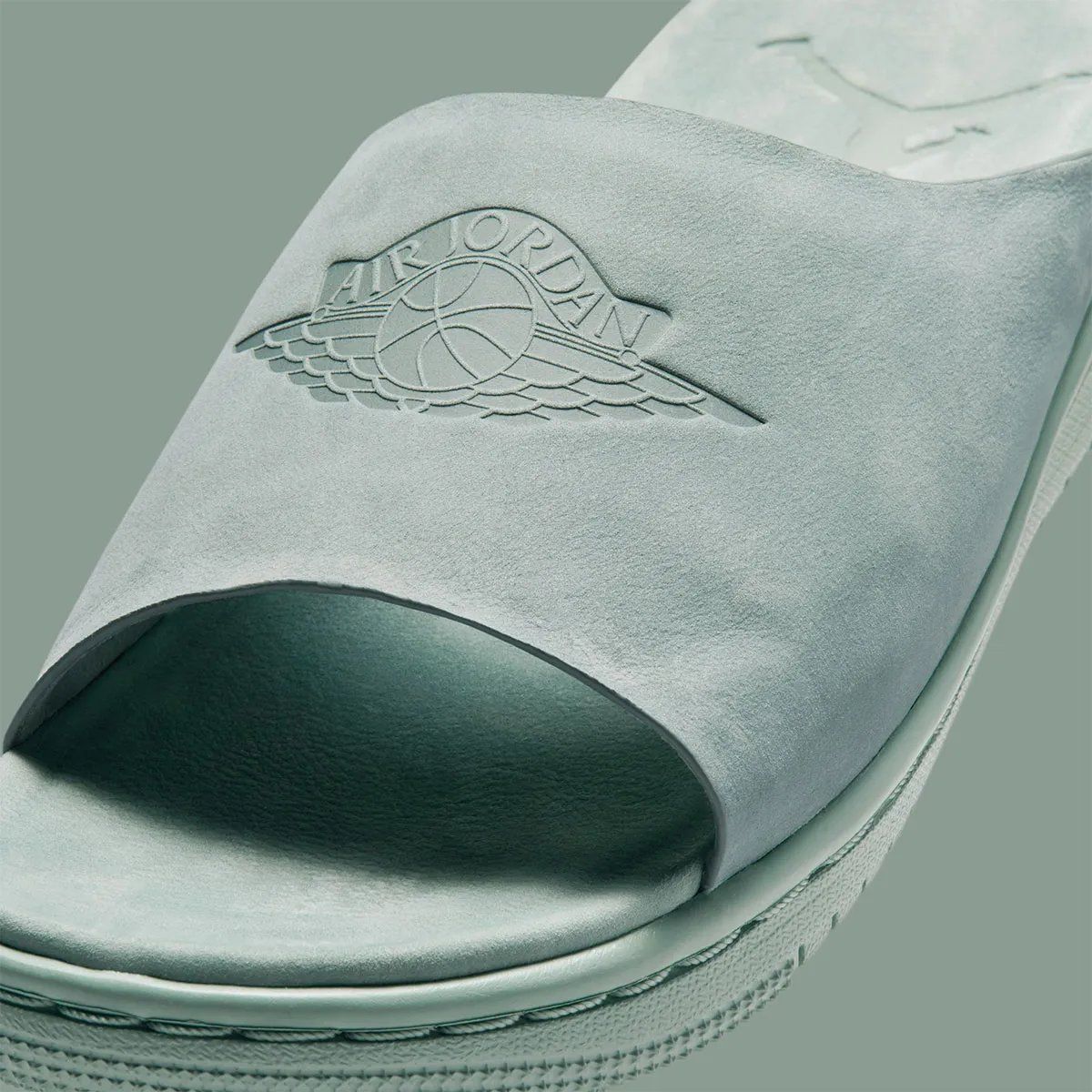 Jordan Modero 1 Slide in neutral colorway showing premium material construction and minimal branding