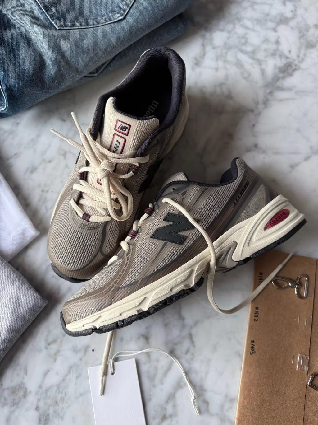 New Balance 740 silhouette in collaborative colorway with JJJJound branding