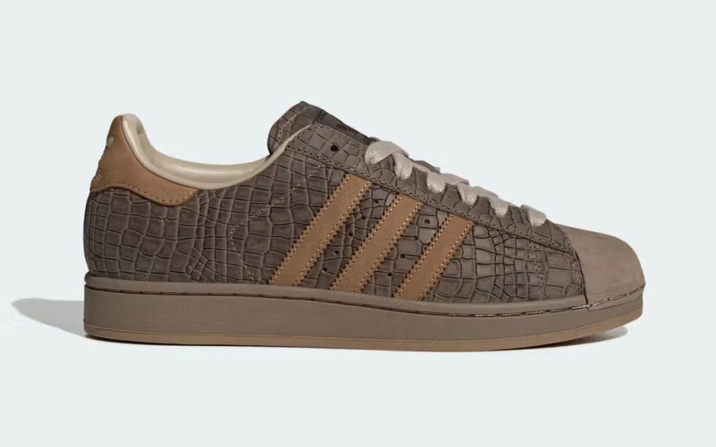 Adidas Superstar in Khaki Croc colorway with crocodile-textured leather upper and classic shell toe