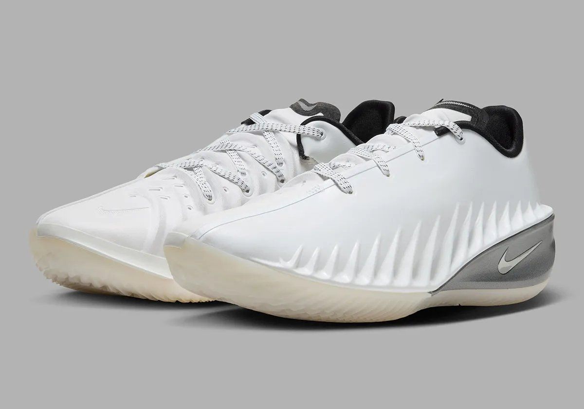 Nike GT Cut 4 SE in Summit White colorway featuring white synthetic upper, black interior, brushed metallic silver heel, and semi-translucent outsole